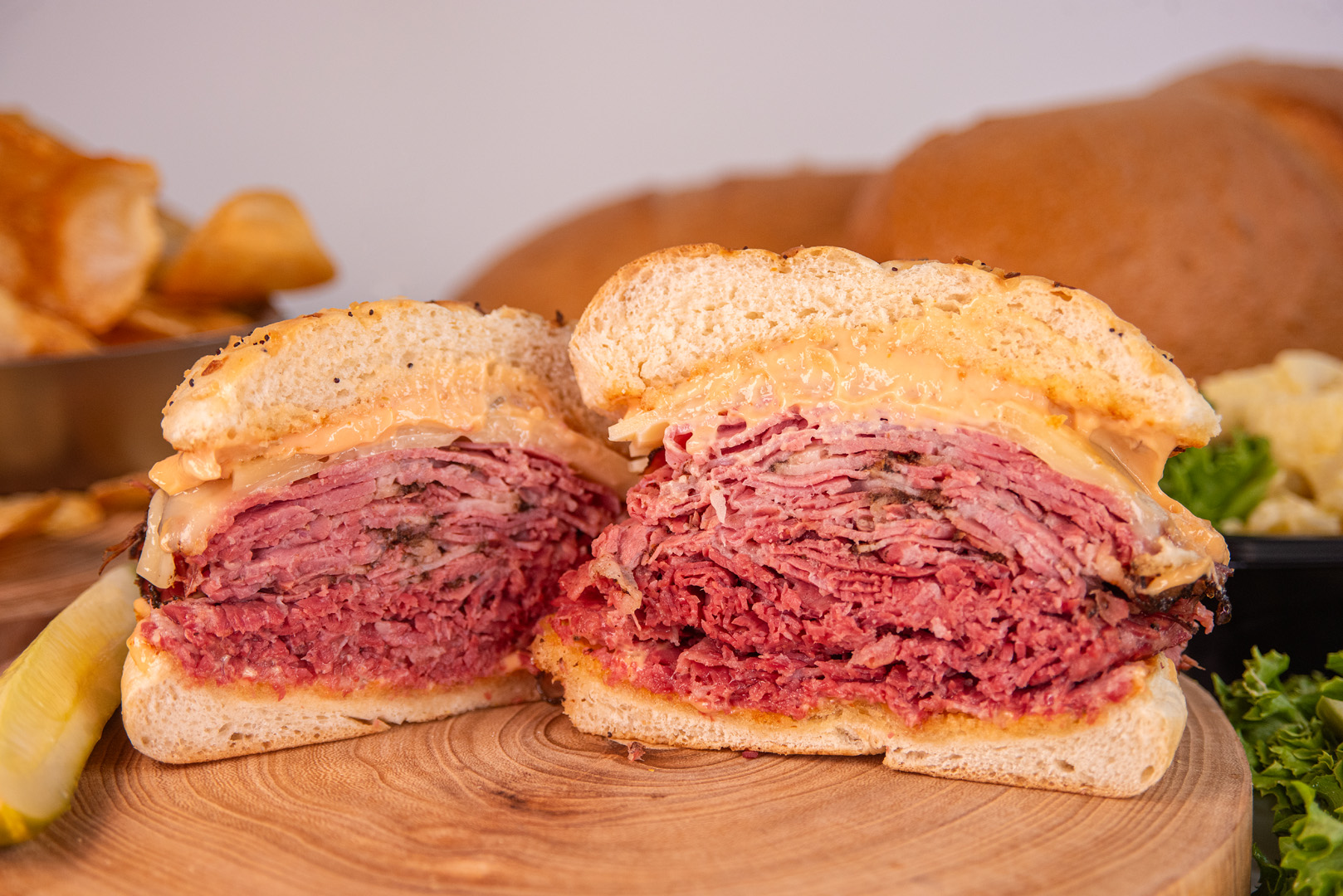 The United Meat corned beef sandwich, sliced to show a mountain of fresh-cut corned beef